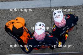 Qualifying top three in parc ferme (L to R): Lando Norris (GBR) McLaren, third; Max Verstappen (NLD) Red Bull Racing, pole position; Sergio Perez (MEX) Red Bull Racing, second. 06.04.2024. Formula 1 World Championship, Rd 4, Japanese Grand Prix, Suzuka, Japan, Qualifying Day.