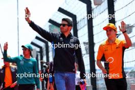 (L to R): Esteban Ocon (FRA) Alpine F1 Team and Oscar Piastri (AUS) McLaren on the drivers' parade. 07.04.2024. Formula 1 World Championship, Rd 4, Japanese Grand Prix, Suzuka, Japan, Race Day.
