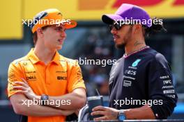 (L to R): Oscar Piastri (AUS) McLaren and Lewis Hamilton (GBR) Mercedes AMG F1 on the drivers' parade. 07.04.2024. Formula 1 World Championship, Rd 4, Japanese Grand Prix, Suzuka, Japan, Race Day.