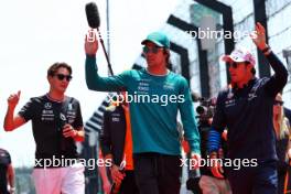 (L to R): Lance Stroll (CDN) Aston Martin F1 Team and Sergio Perez (MEX) Red Bull Racing on the drivers' parade. 07.04.2024. Formula 1 World Championship, Rd 4, Japanese Grand Prix, Suzuka, Japan, Race Day.