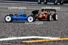 (L to R): Radio controlled cars for Esteban Ocon (FRA) Alpine F1 Team and Oscar Piastri (AUS) McLaren. 04.04.2024. Formula 1 World Championship, Rd 4, Japanese Grand Prix, Suzuka, Japan, Preparation Day.