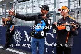 (L to R): Esteban Ocon (FRA) Alpine F1 Team and Oscar Piastri (AUS) McLaren - radio controlled cars. 04.04.2024. Formula 1 World Championship, Rd 4, Japanese Grand Prix, Suzuka, Japan, Preparation Day.