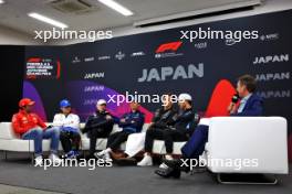 (L to R): Carlos Sainz Jr (ESP) Ferrari; Yuki Tsunoda (JPN) RB; Max Verstappen (NLD) Red Bull Racing; Alexander Albon (THA) Williams Racing; George Russell (GBR) Mercedes AMG F1; Pierre Gasly (FRA) Alpine F1 Team; and Tom Clarkson (GBR) Journalist, in the FIA Press Conference. 04.04.2024. Formula 1 World Championship, Rd 4, Japanese Grand Prix, Suzuka, Japan, Preparation Day.