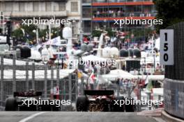 (L to R): Lewis Hamilton (GBR) Mercedes AMG F1 W15 and Carlos Sainz Jr (ESP) Ferrari SF-24. 24.05.2024. Formula 1 World Championship, Rd 8, Monaco Grand Prix, Monte Carlo, Monaco, Practice Day.