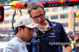 (L to R): Sergio Perez (MEX) Red Bull Racing with Hugh Bird (GBR) Red Bull Racing Engineer. 24.05.2024. Formula 1 World Championship, Rd 8, Monaco Grand Prix, Monte Carlo, Monaco, Practice Day.