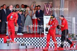 Race winner Charles Leclerc (MON) Ferrari celebrates with the champagne with Carlos Sainz Jr (ESP) Ferrari and Frederic Vasseur (FRA) Ferrari Team Principal on the podium. 26.05.2024. Formula 1 World Championship, Rd 8, Monaco Grand Prix, Monte Carlo, Monaco, Race Day.