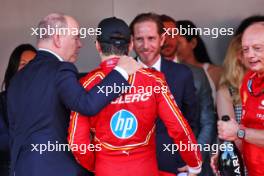 (L to R): HSH Prince Albert of Monaco (MON) with race winner Charles Leclerc (MON) Ferrari on the podium. 26.05.2024. Formula 1 World Championship, Rd 8, Monaco Grand Prix, Monte Carlo, Monaco, Race Day.