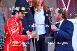 Carlos Sainz Jr (ESP) Ferrari celebrates his third position with Andrea Casiraghi (MON) on the podium. 26.05.2024. Formula 1 World Championship, Rd 8, Monaco Grand Prix, Monte Carlo, Monaco, Race Day.