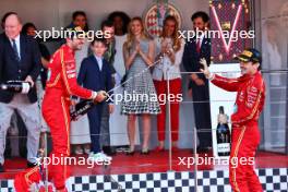 Race winner Charles Leclerc (MON) Ferrari celebrates with the champagne with Carlos Sainz Jr (ESP) Ferrari. 26.05.2024. Formula 1 World Championship, Rd 8, Monaco Grand Prix, Monte Carlo, Monaco, Race Day.