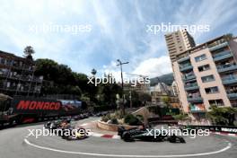 George Russell (GBR) Mercedes AMG F1 W15 leads Max Verstappen (NLD) Red Bull Racing RB20 at the start of the race. 26.05.2024. Formula 1 World Championship, Rd 8, Monaco Grand Prix, Monte Carlo, Monaco, Race Day.