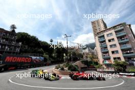 Charles Leclerc (MON) Ferrari SF-24 leads Oscar Piastri (AUS) McLaren MCL38 at the start of the race. 26.05.2024. Formula 1 World Championship, Rd 8, Monaco Grand Prix, Monte Carlo, Monaco, Race Day.
