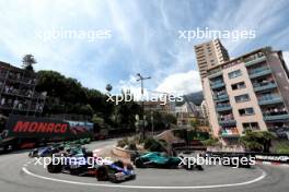 Lance Stroll (CDN) Aston Martin F1 Team AMR24 and Daniel Ricciardo (AUS) RB VCARB 01 at the start of the race. 26.05.2024. Formula 1 World Championship, Rd 8, Monaco Grand Prix, Monte Carlo, Monaco, Race Day.