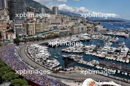 Sergio Perez (MEX) Red Bull Racing RB20 and Lando Norris (GBR) McLaren MCL38. 25.05.2024. Formula 1 World Championship, Rd 8, Monaco Grand Prix, Monte Carlo, Monaco, Qualifying Day.