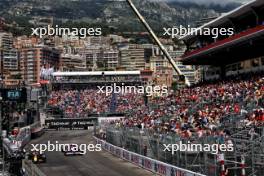 Max Verstappen (NLD) Red Bull Racing RB20 and Yuki Tsunoda (JPN) RB VCARB 01. 25.05.2024. Formula 1 World Championship, Rd 8, Monaco Grand Prix, Monte Carlo, Monaco, Qualifying Day.