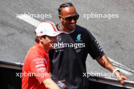 (L to R): Charles Leclerc (MON) Ferrari and Lewis Hamilton (GBR) Mercedes AMG F1 on the drivers' parade. 26.05.2024. Formula 1 World Championship, Rd 8, Monaco Grand Prix, Monte Carlo, Monaco, Race Day.