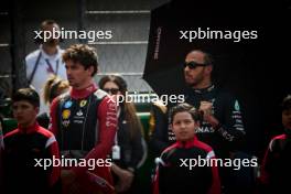 (L to R): Charles Leclerc (MON) Ferrari and Lewis Hamilton (GBR) Mercedes AMG F1 on the drivers' parade. 27.10.2024. Formula 1 World Championship, Rd 20, Mexican Grand Prix, Mexico City, Mexico, Race Day.