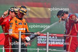 Lando Norris (GBR) McLaren (Left) celebrates his second position with race winner Carlos Sainz Jr (ESP) Ferrari on the podium. 27.10.2024. Formula 1 World Championship, Rd 20, Mexican Grand Prix, Mexico City, Mexico, Race Day.