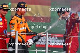 Lando Norris (GBR) McLaren (Left) celebrates his second position with race winner Carlos Sainz Jr (ESP) Ferrari on the podium. 27.10.2024. Formula 1 World Championship, Rd 20, Mexican Grand Prix, Mexico City, Mexico, Race Day.