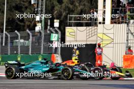 Lance Stroll (CDN) Aston Martin F1 Team AMR24 and Sergio Perez (MEX) Red Bull Racing RB20 battle for position. 27.10.2024. Formula 1 World Championship, Rd 20, Mexican Grand Prix, Mexico City, Mexico, Race Day.