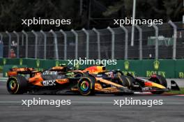 Max Verstappen (NLD) Red Bull Racing RB20 and Lando Norris (GBR) McLaren MCL38 battle for position. 27.10.2024. Formula 1 World Championship, Rd 20, Mexican Grand Prix, Mexico City, Mexico, Race Day.