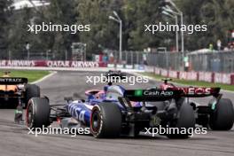 Lewis Hamilton (GBR) Mercedes AMG F1 W15 and Liam Lawson (NZL) RB VCARB 01 battle for position.  27.10.2024. Formula 1 World Championship, Rd 20, Mexican Grand Prix, Mexico City, Mexico, Race Day.