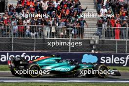 Lance Stroll (CDN) Aston Martin F1 Team AMR24 and Sergio Perez (MEX) Red Bull Racing RB20 battle for position. 27.10.2024. Formula 1 World Championship, Rd 20, Mexican Grand Prix, Mexico City, Mexico, Race Day.