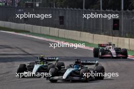 George Russell (GBR) Mercedes AMG F1 W15 and Lewis Hamilton (GBR) Mercedes AMG F1 W15 battle for position. 27.10.2024. Formula 1 World Championship, Rd 20, Mexican Grand Prix, Mexico City, Mexico, Race Day.