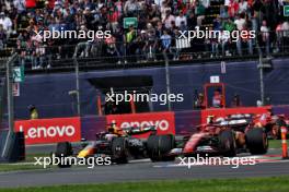 Max Verstappen (NLD) Red Bull Racing RB20 and Carlos Sainz Jr (ESP) Ferrari SF-24 battle for position. 27.10.2024. Formula 1 World Championship, Rd 20, Mexican Grand Prix, Mexico City, Mexico, Race Day.