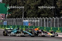 Lance Stroll (CDN) Aston Martin F1 Team AMR24 and Sergio Perez (MEX) Red Bull Racing RB20 battle for position. 27.10.2024. Formula 1 World Championship, Rd 20, Mexican Grand Prix, Mexico City, Mexico, Race Day.