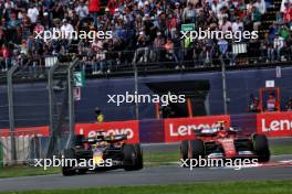 Max Verstappen (NLD) Red Bull Racing RB20 and Carlos Sainz Jr (ESP) Ferrari SF-24 battle for position. 27.10.2024. Formula 1 World Championship, Rd 20, Mexican Grand Prix, Mexico City, Mexico, Race Day.