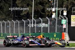 Liam Lawson (NZL) RB VCARB 01 and Sergio Perez (MEX) Red Bull Racing RB20 battle for position. 27.10.2024. Formula 1 World Championship, Rd 20, Mexican Grand Prix, Mexico City, Mexico, Race Day.