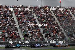 Oscar Piastri (AUS) McLaren MCL38 leads Liam Lawson (NZL) RB VCARB 01 and Lewis Hamilton (GBR) Mercedes AMG F1 W15. 27.10.2024. Formula 1 World Championship, Rd 20, Mexican Grand Prix, Mexico City, Mexico, Race Day.