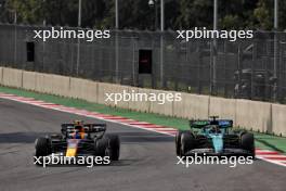 Sergio Perez (MEX) Red Bull Racing RB20 and Lance Stroll (CDN) Aston Martin F1 Team AMR24 battle for position. 27.10.2024. Formula 1 World Championship, Rd 20, Mexican Grand Prix, Mexico City, Mexico, Race Day.