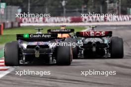 Lewis Hamilton (GBR) Mercedes AMG F1 W15 and Liam Lawson (NZL) RB VCARB 01 battle for position.  27.10.2024. Formula 1 World Championship, Rd 20, Mexican Grand Prix, Mexico City, Mexico, Race Day.