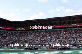 George Russell (GBR) Mercedes AMG F1 W15 leads team mate Lewis Hamilton (GBR) Mercedes AMG F1 W15. 27.10.2024. Formula 1 World Championship, Rd 20, Mexican Grand Prix, Mexico City, Mexico, Race Day.