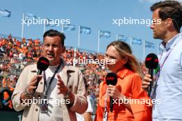 (L to R): Will Buxton (GBR) F1 Digital Presenter with Ruth Buscombe (GBR) F1TV Presenter and Jolyon Palmer (GBR) F1 Digital Presenter on the grid. 25.08.2024. Formula 1 World Championship, Rd 15, Dutch Grand Prix, Zandvoort, Netherlands, Race Day.