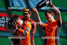 Race winner Lando Norris (GBR) McLaren celebrates with Charles Leclerc (MON) Ferrari and William Joseph (GBR) McLaren Race Engineer on the podium. 25.08.2024. Formula 1 World Championship, Rd 15, Dutch Grand Prix, Zandvoort, Netherlands, Race Day.