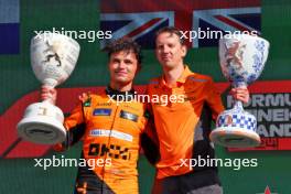 (L to R): Race winner Lando Norris (GBR) McLaren celebrates on the podium with William Joseph (GBR) McLaren Race Engineer. 25.08.2024. Formula 1 World Championship, Rd 15, Dutch Grand Prix, Zandvoort, Netherlands, Race Day.