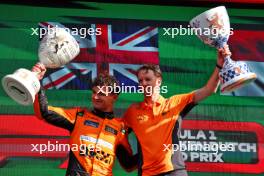 (L to R): Race winner Lando Norris (GBR) McLaren celebrates with William Joseph (GBR) McLaren Race Engineer on the podium. 25.08.2024. Formula 1 World Championship, Rd 15, Dutch Grand Prix, Zandvoort, Netherlands, Race Day.