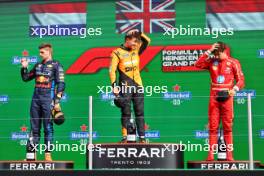 The podium (L to R): Max Verstappen (NLD) Red Bull Racing, second; Lando Norris (GBR) McLaren, race winner; Charles Leclerc (MON) Ferrari, third. 25.08.2024. Formula 1 World Championship, Rd 15, Dutch Grand Prix, Zandvoort, Netherlands, Race Day.