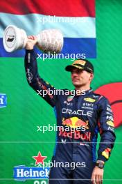 Max Verstappen (NLD) Red Bull Racing celebrates his second position on the podium. 25.08.2024. Formula 1 World Championship, Rd 15, Dutch Grand Prix, Zandvoort, Netherlands, Race Day.