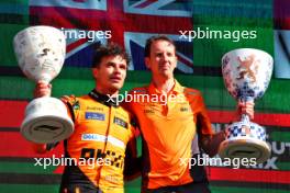 (L to R): Race winner Lando Norris (GBR) McLaren celebrates with William Joseph (GBR) McLaren Race Engineer on the podium. 25.08.2024. Formula 1 World Championship, Rd 15, Dutch Grand Prix, Zandvoort, Netherlands, Race Day.