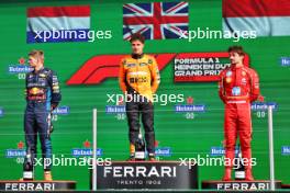 The podium (L to R): Max Verstappen (NLD) Red Bull Racing, second; Lando Norris (GBR) McLaren, race winner; Charles Leclerc (MON) Ferrari, third. 25.08.2024. Formula 1 World Championship, Rd 15, Dutch Grand Prix, Zandvoort, Netherlands, Race Day.