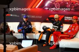 (L to R): Max Verstappen (NLD) Red Bull Racing; Lando Norris (GBR) McLaren; and Charles Leclerc (MON) Ferrari, in the post race FIA Press Conference. 25.08.2024. Formula 1 World Championship, Rd 15, Dutch Grand Prix, Zandvoort, Netherlands, Race Day.