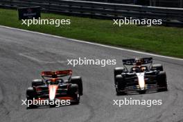 Lando Norris (GBR) McLaren MCL38 passes Max Verstappen (NLD) Red Bull Racing RB20 to take the lead of the race. 25.08.2024. Formula 1 World Championship, Rd 15, Dutch Grand Prix, Zandvoort, Netherlands, Race Day.