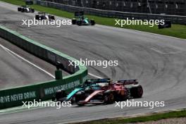 Fernando Alonso (ESP) Aston Martin F1 Team AMR24 and Carlos Sainz Jr (ESP) Ferrari SF-24 battle for position. 25.08.2024. Formula 1 World Championship, Rd 15, Dutch Grand Prix, Zandvoort, Netherlands, Race Day.