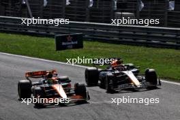 Lando Norris (GBR) McLaren MCL38 passes Max Verstappen (NLD) Red Bull Racing RB20 to take the lead of the race. 25.08.2024. Formula 1 World Championship, Rd 15, Dutch Grand Prix, Zandvoort, Netherlands, Race Day.