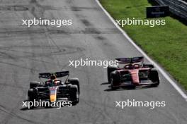 Sergio Perez (MEX) Red Bull Racing RB20 and Carlos Sainz Jr (ESP) Ferrari SF-24 battle for position. 25.08.2024. Formula 1 World Championship, Rd 15, Dutch Grand Prix, Zandvoort, Netherlands, Race Day.