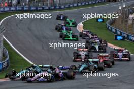 Pierre Gasly (FRA) Alpine F1 Team A524 and Fernando Alonso (ESP) Aston Martin F1 Team AMR24 at the start of the race. 25.08.2024. Formula 1 World Championship, Rd 15, Dutch Grand Prix, Zandvoort, Netherlands, Race Day.