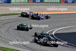 Alexander Albon (THA) Williams Racing FW46 and Pierre Gasly (FRA) Alpine F1 Team A524 battle for position ahead of Fernando Alonso (ESP) Aston Martin F1 Team AMR24; Lance Stroll (CDN) Aston Martin F1 Team AMR24; and Kevin Magnussen (DEN) Haas VF-24. 25.08.2024. Formula 1 World Championship, Rd 15, Dutch Grand Prix, Zandvoort, Netherlands, Race Day.